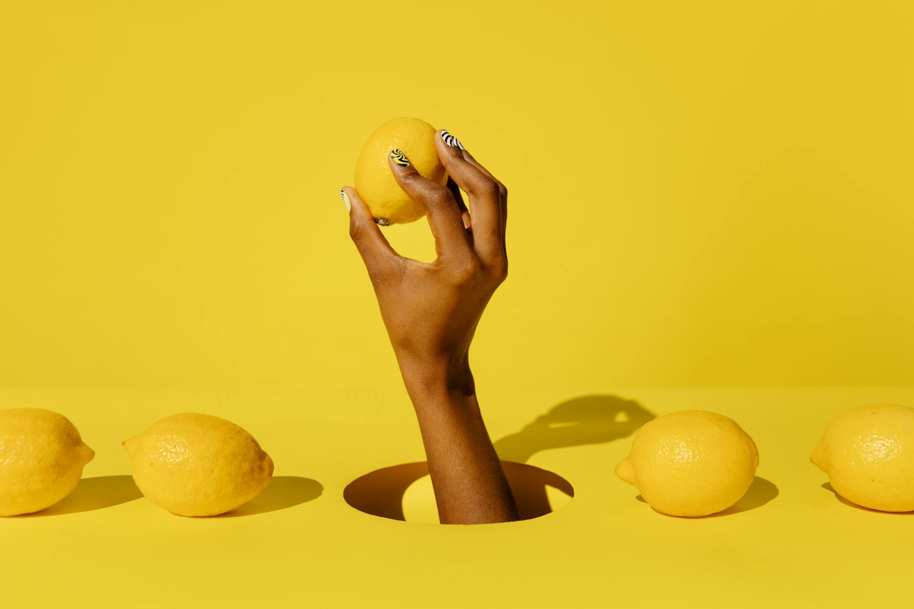 Fresh yellow lemons arranged on a pastel background, symbolizing brightness and citrus freshness